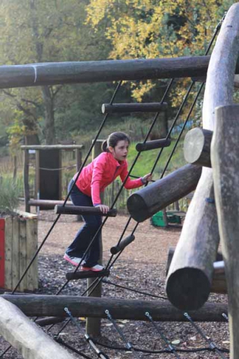 girl climbing on ropes